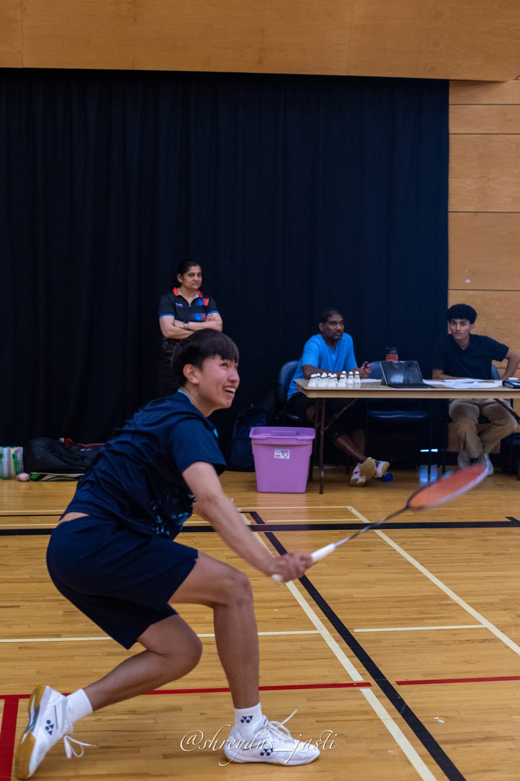 Player lunging for a shot during finals